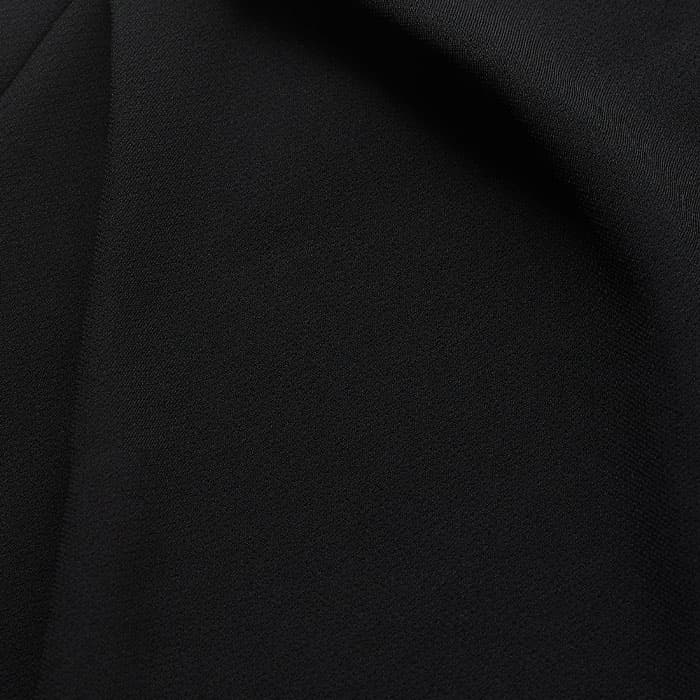 Crafted from fluid, crease-resistant crepe.