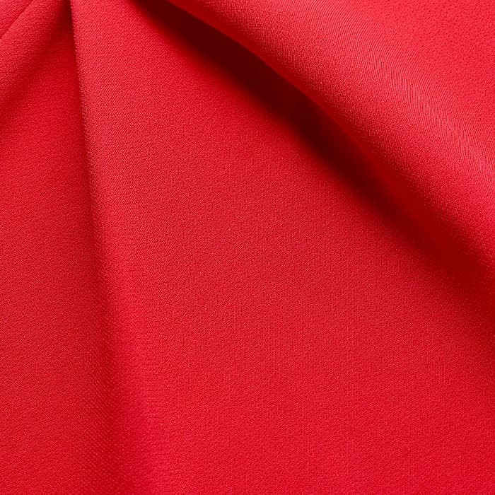 Crafted from fluid, crease-resistant crepe.