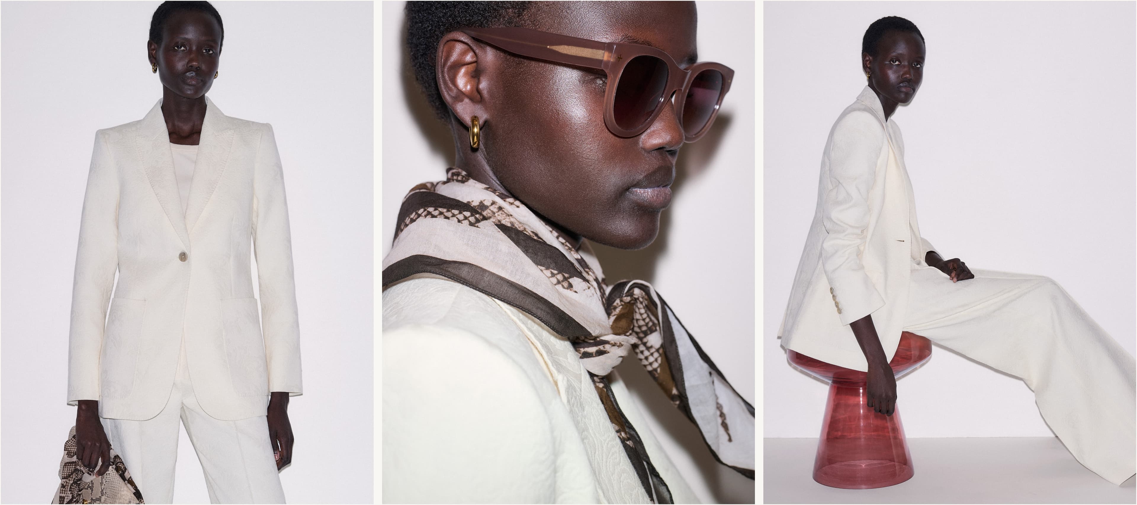 Left Image: Woman against a beige backdrop wearing a white suit. Middle Image: Woman against a beige backdrop wearing sunglasses and a neck scarf. Right Image: Woman sat on a stool, facing side on to the camera.