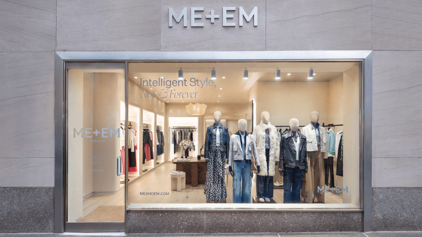 ME+EM Madison Avenue store front with marble bricks and mannequins in window